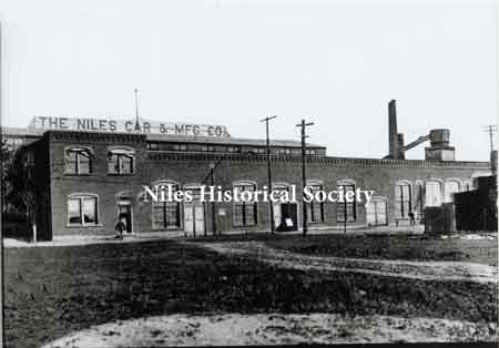 Erie Street view of the Niles Car and Manufacturing Company, makers of one of the finest lines of plush electric cars of the area.