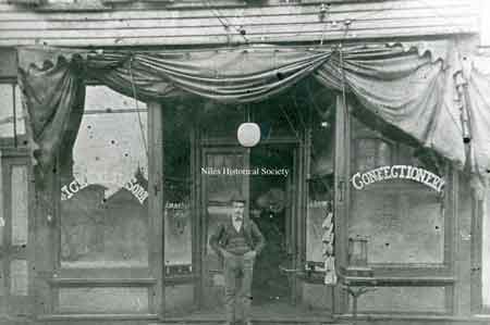 Photo taken of Milo Caramella standing in front of his confectionery store on Main Street about 1900.