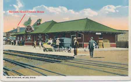 The McGurk Hotel, which later became the Fostoria House, can be seen to the left of the Erie Depot on Railroad Street in this postcard