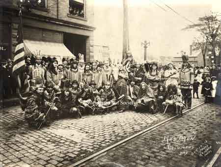 A photo of the members of the Niles 'Red Man Lodge' in front of the Odd Fellows Hall on Main Street. October 12, 1918 for a special Columbus Day event.