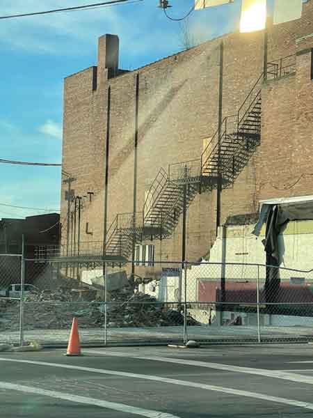 View of the Robins Theatre Building after the razing of Reisman's Store at the corner of South Main and West State Streets.