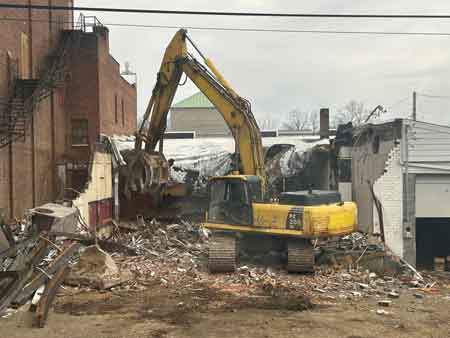 Demolition of Reisman's store next to Robins Theatre.