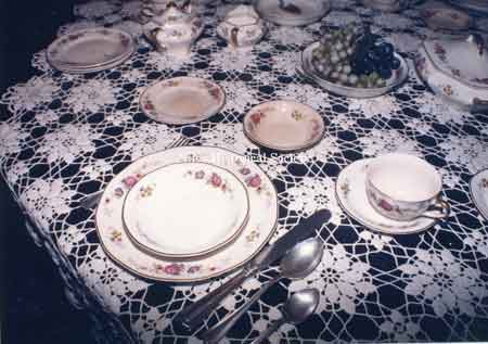 Photo taken in the Thomas House dining room of a table set with Atlas China.