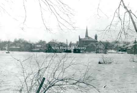 The Mahoning River in full spate from the south side of Niles looking north toward St. Stephen's Church and school.