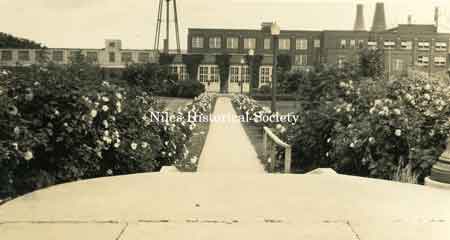 Photo of the main entrance and gardens of the General Electric Plant