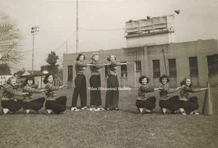 Cheerleaders posing in front of Riverside Stadium, ca 1948.