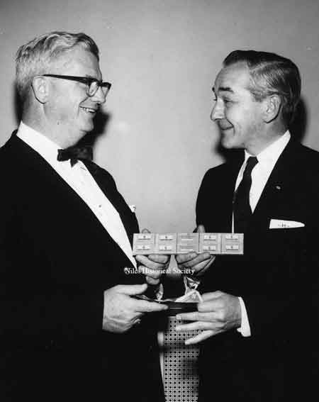 The 1955 Kiwanis razor blade sales campaign, "Look Sharp". Leonard Holloway (right) selling blades to Mayor Lenney (left)