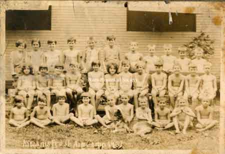 Fresh Air Camp (1931) with boys and girls in front of shower and camp kitchen building.