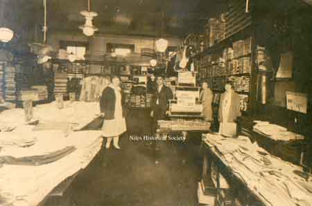 Interior photograph, 1935 ca, of the Shaker store with Isaac in the center.