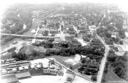An aerial view of the Niles Firebrick kilns looking west with the Mahoning River and Pennsylvania Railroad stations and yard on the left side.