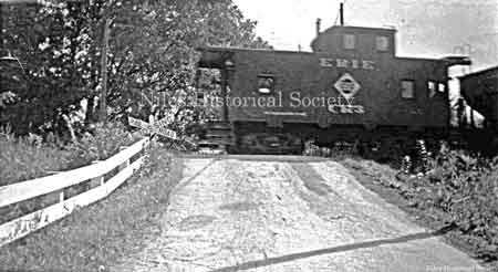 Erie Rail Road caboose as it crosses over County Line Road in Mineral Ridge.