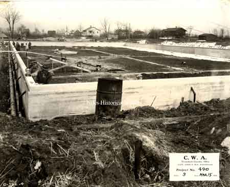 With the Great Depression of the 1930’s in full effect, the federal government announced a public works program offering to pay 30% of the cost of projects that would give work to the needy. The idea of a swimming pool and bath house in Waddell Park began to take shape.