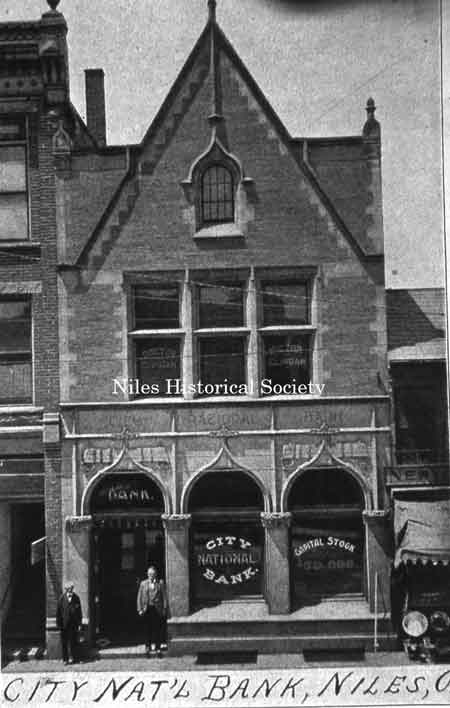 Close-up of the bank building with the second floor occupied by Dr. Thomas Clingan as indicated by the lettering on the windows.