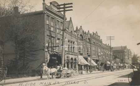 Photograph on the left shows the west side of South Main Street as it appeared at the turn of the century in 1894.