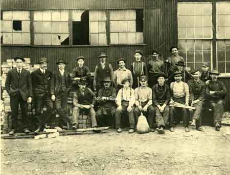 The 1908 Empire Steel roofing crew with their vice president W. H. Ward.