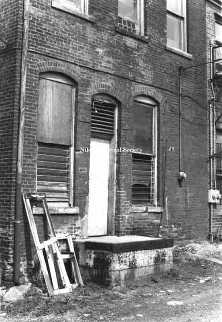 Photo taken of rear entrance to a building located in downtown Niles before urban renewal.