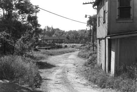 Photo taken of back alley leading to the old Pennsylvania RR station located under the Main Street Viaduct in downtown Niles before urban renewal.