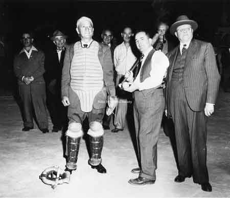 Ernie Ziegler, the mayor and an unidentified catcher at Waddell Park, the night the lights were installed at the baseball fields.