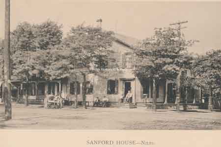 The Sandford House appears to have a covered porch facing James Street(now Park Avenue) and two additional add-ons forming a 'U' shape with an open area in between the additions.
