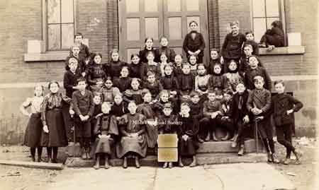 Photo of a class of younger children from Central School taken sometime before 1910.