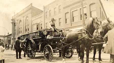 View of a horsedrawn fire engine on State Street