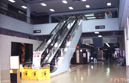 The escalator inside the main front entrance of the Eastwood Mall during renovations in the 1990's. Dated Feb. 25, 1995