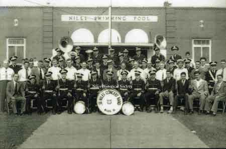 A picture of the Niles Concert Band in front of the Waddell Park Swimming Pool house, possibly at the dedication in 1934.