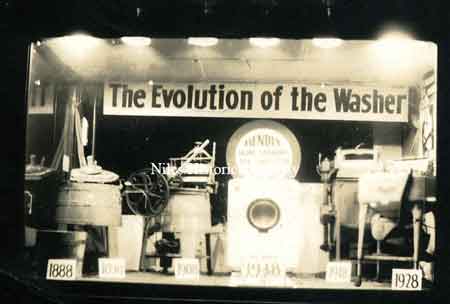 Window display at Rice Electric shows the evolution of the washing machine.