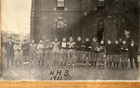 1911 Niles Football team, with names of players, photographed outside the old Central School on East State Street.