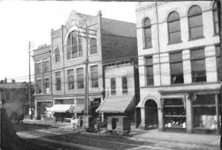 This picture of buildings in down town shows Calvins, Odd fellows, Bakery, large building in right foreground is the Wagstaff building,
