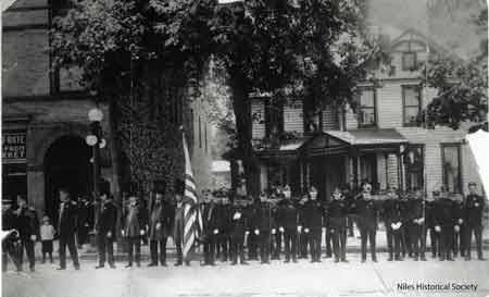 The Knights of Pythias members in front of the Wagstaff building, which stood north of the Swaney building on North Main Street, on the west side of the street. (Where the McKinley Memorial stands now.) Note the house that has not been removed from the Memorial grounds.