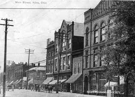 The Swaney block- now gone is next on the right. The IOOF building, also gone housed Backenstos Jewelry, Wells Fargo and Singer Sewing Machine Company.