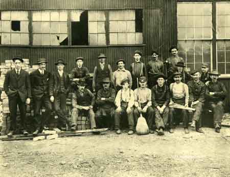 The 1908 Empire Steel roofing crew with their vice president W. H. Ward
