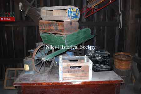 Wooden boxes and wheelbarrow