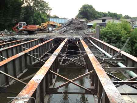 Demolition in 2013 of the 1953 bridge that carries Robbins Avenue traffic across the Mosquito Creek.