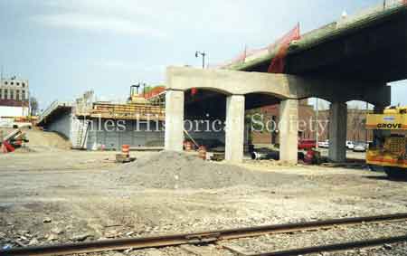 Photo showing the destruction and rebuilding of the Niles Viaduct connecting the south side of the city to the downtown area. 2002