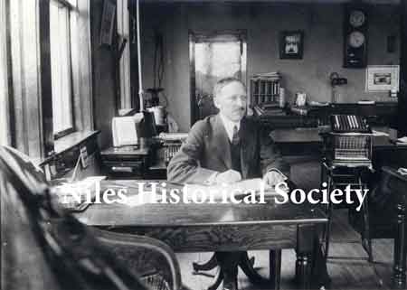 Mr. C. E. Rose, secretary and treasurer of Niles Car & Manufacturing Co. at his desk in the company office about 1912