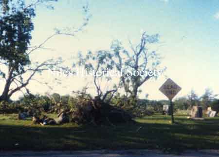 iew of cemetery destruction at Bentley Avenue and 'Dead End' sign.