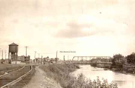 View looking eastward the old iron bridge and RR crossing over the Mahoning River near Water Street.