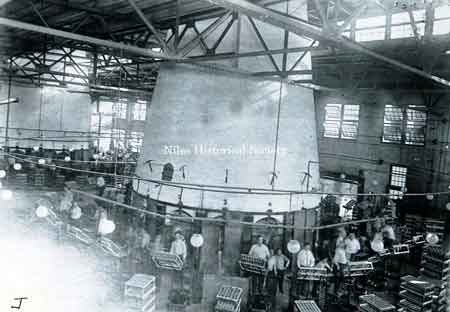 Photo of one of the glass furnaces and crew