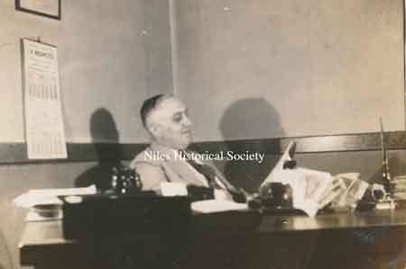 Sam Mango at his desk.