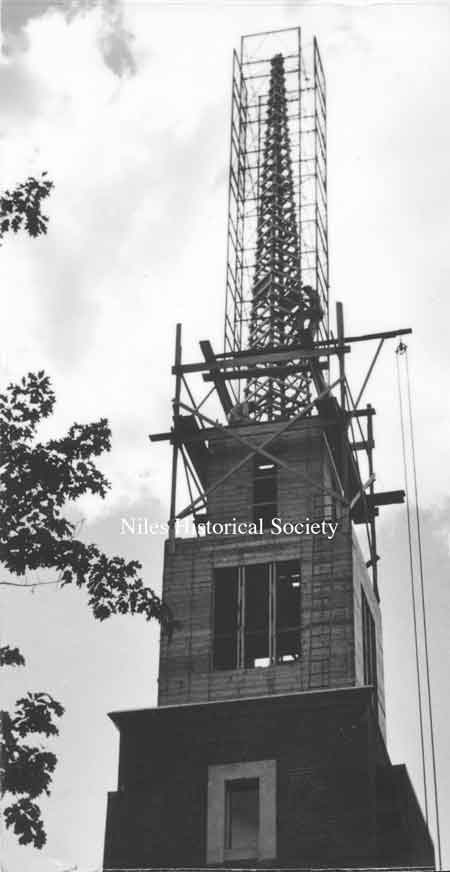 Steeple with scaffolding in place to attach stainless steel panels.