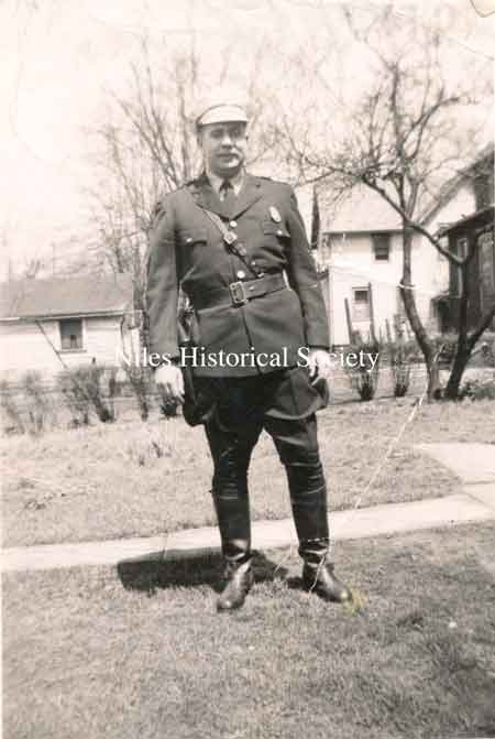 Officer John Scott wearing the uniform of a motorcycle policeman in the 1950s.