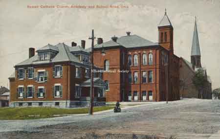 Another postcard view of the school and church looking north along Arlington Avenue.