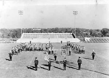 Niles High School Band in 1942 with the football stadium in the background.