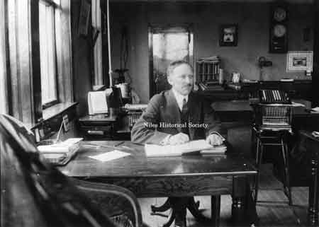 Mr. C. E. Rose, secretary and treasurer of Niles Car & Manufacturing Co. at his desk in the company office about 1912.