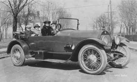 Four people in the Stutz Bulldog