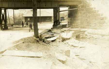 Taken in 1913, this photograph shows the Erie Railroad overpass at Robbins Avenue as it winds into Church Street.