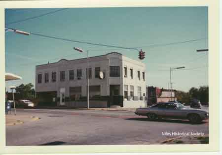 Urban renewal has demolished the buildings around the Hartzell Building. 1974.
