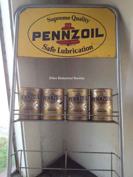 Display rack of oil cans.